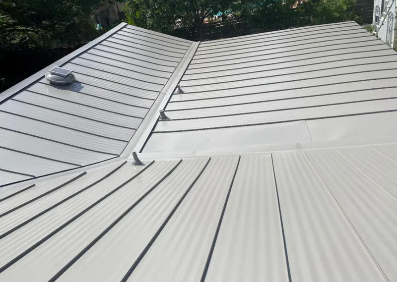 Solar attic fan installed on a metal roof for Roof Ventilation in Calimesa